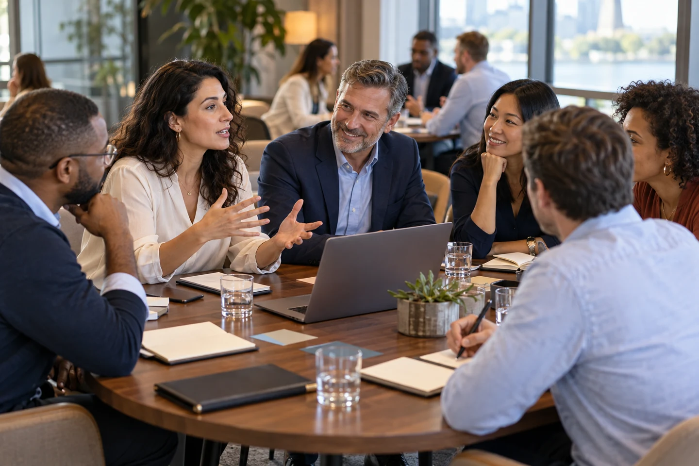 Professionals share ideas and listen to each other during a table discussion.
